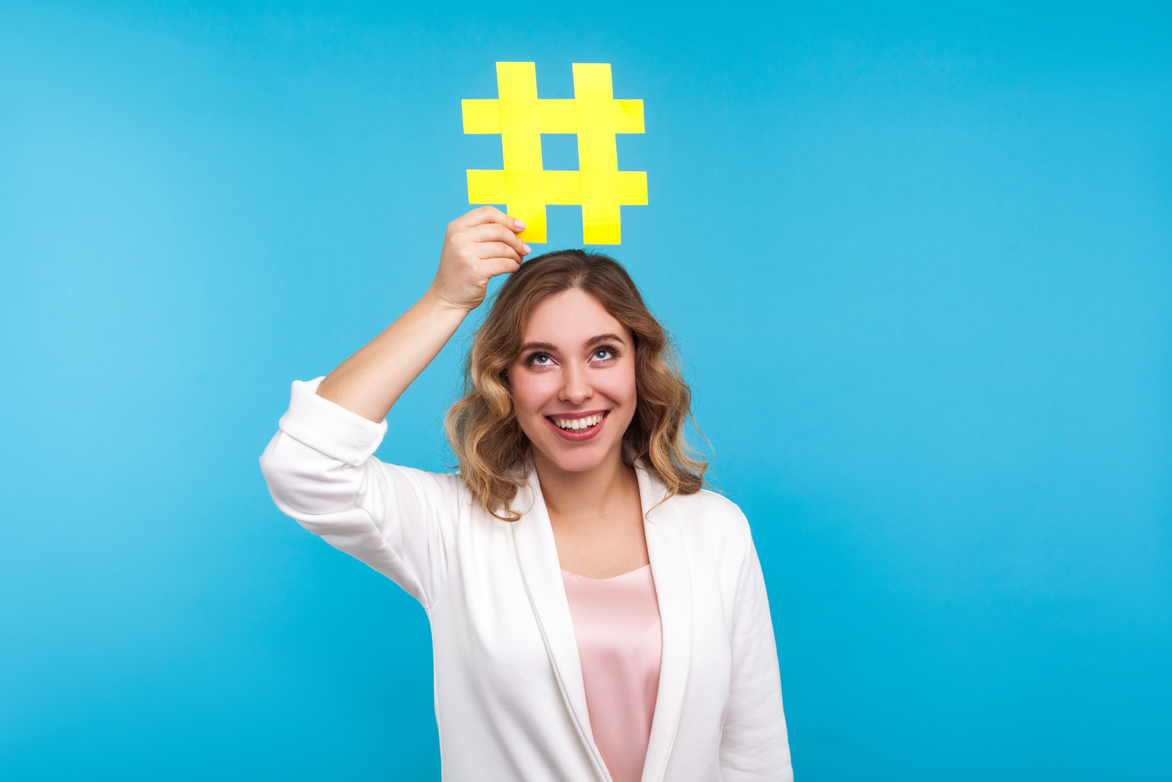 Portrait of Emotional Woman in Jacket on Blue Background.